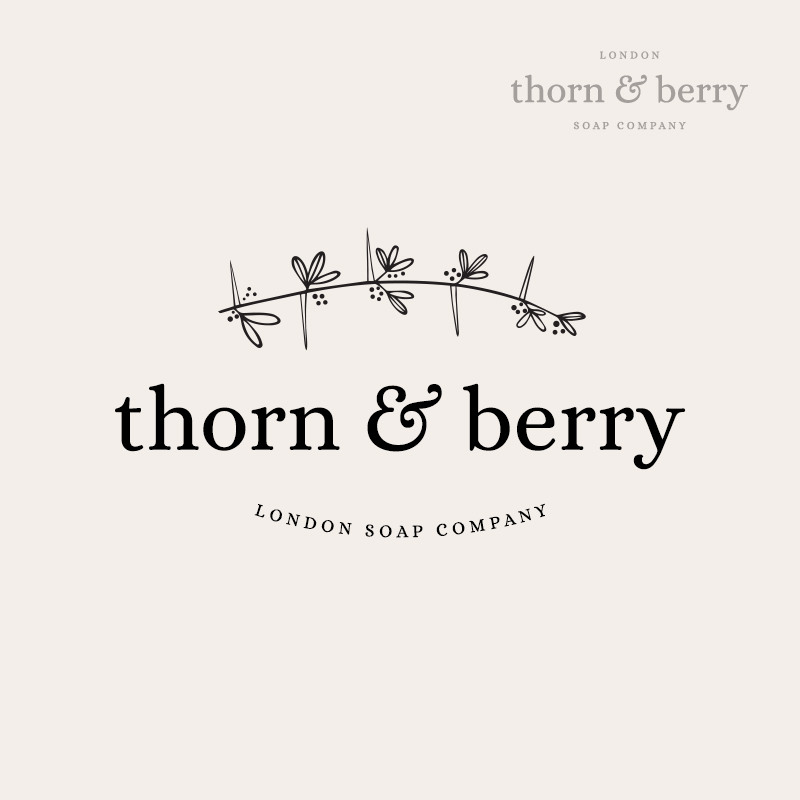 Custom made botanical logo design with sub mar, thorns and berries. For a soap company.